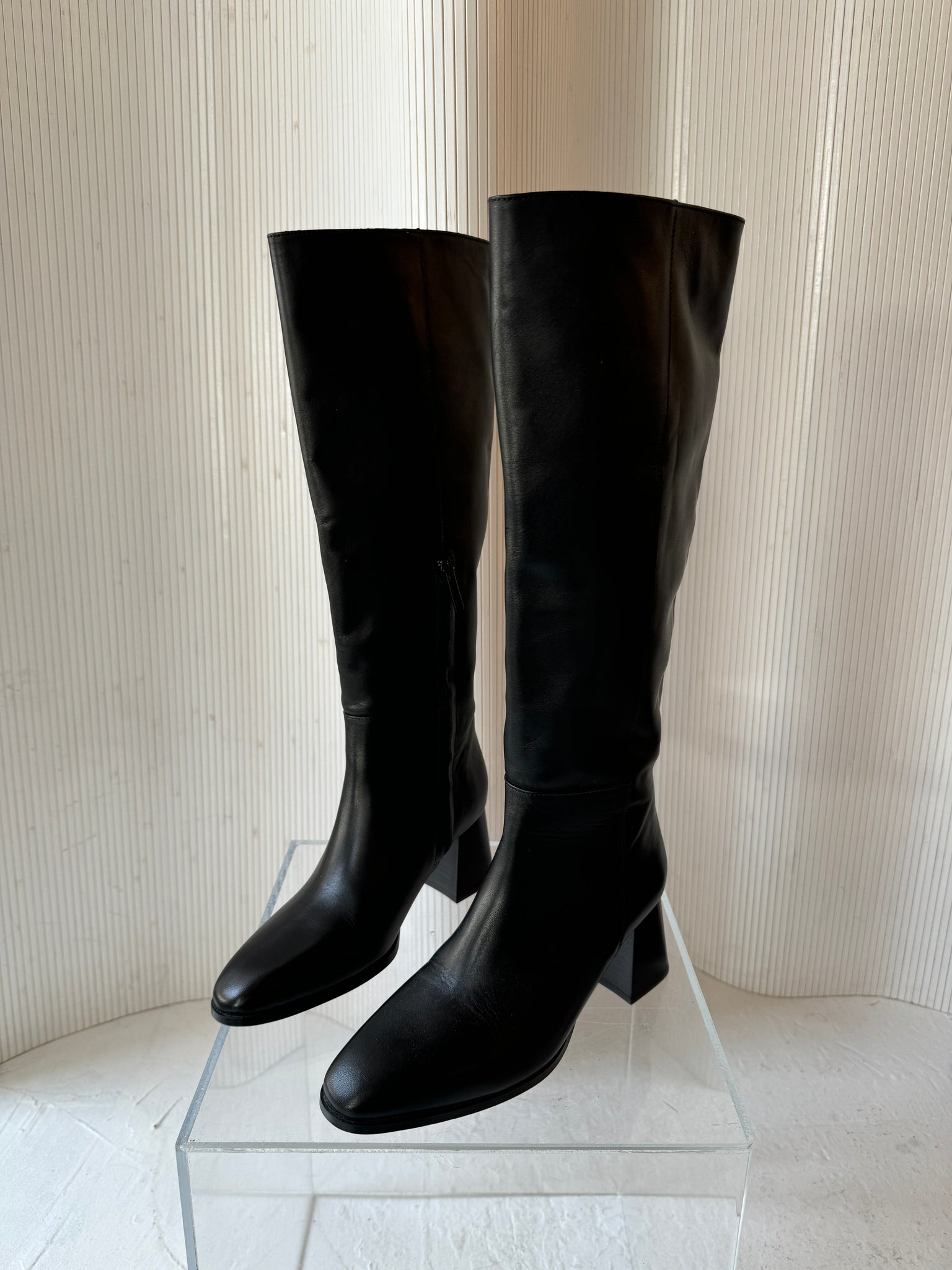 Flattered leather knee high boot